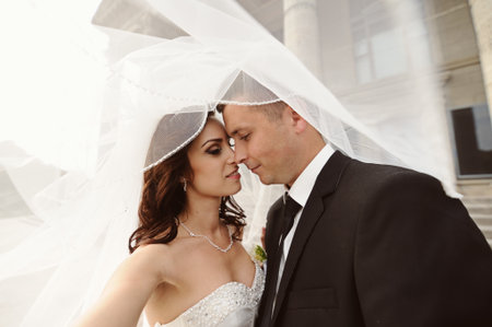 Happy bride and groom on their wedding dayの写真素材