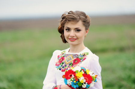portrait of nice girl with white rosesの写真素材