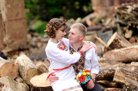 Portrait of affectionate couple with 
bouquet of flowersの写真素材