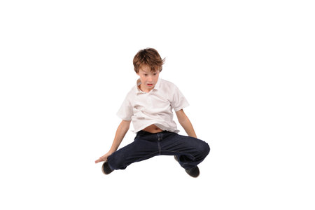 Jumping boy isolated over white backgroundの写真素材