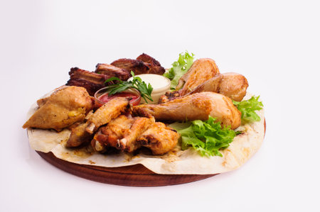 roasted chicken legs with vegetables and potatoの写真素材