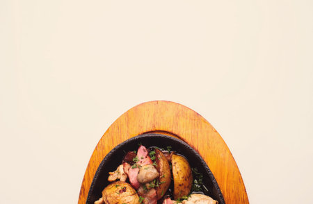 roasted chicken legs with vegetables and potatoの写真素材