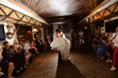 bride and groom dancing on the own weddingの写真素材