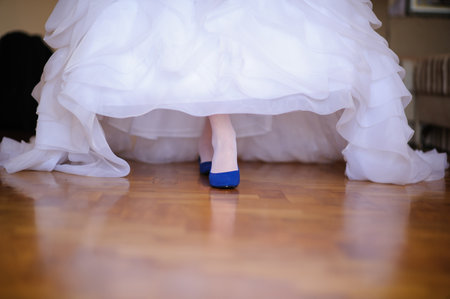 Beautiful woman's  long legs in white wedding dressの写真素材