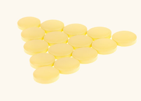 Stack of different pills isolated on white backgroundの写真素材