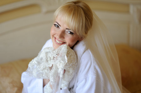 Beautiful bride  indoor near the windowの写真素材