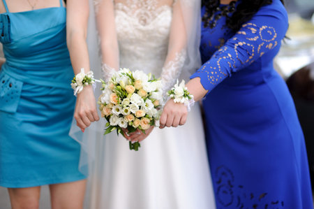 bride with bridesmaid with bouquetsの写真素材