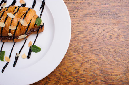 sweet croissant on the wooden tableの写真素材