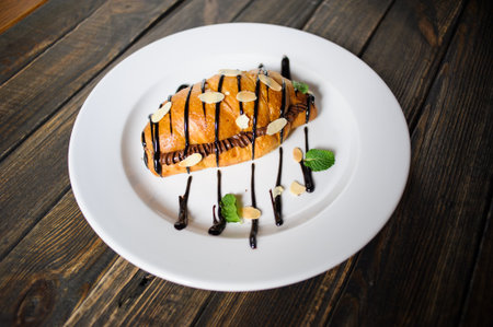 sweet croissant on the wooden tableの写真素材