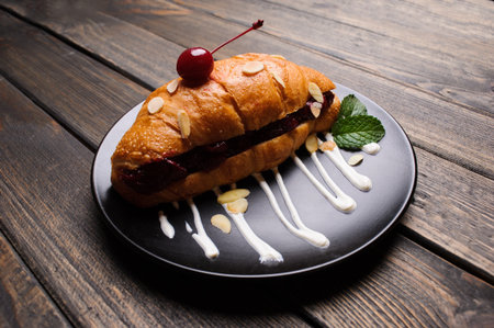 sweet croissant on the wooden tableの写真素材