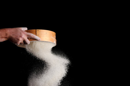 chef sifts flour