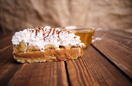 cake with tea on wooden desk