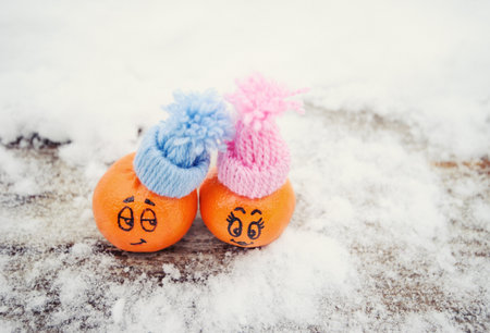 funny facial expressions on the tangerines in hatsの写真素材