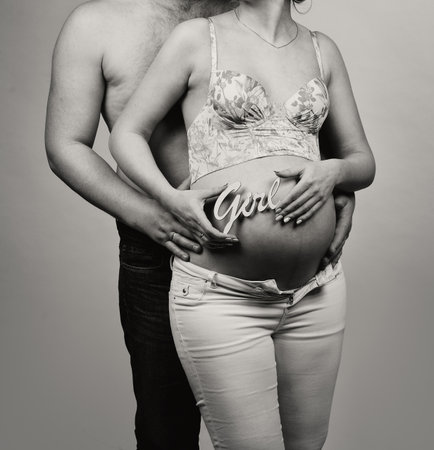 Beautiful young couple expecting babyの写真素材