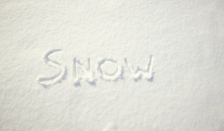 Word "snow" written on snowの写真素材