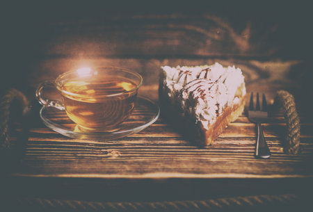 cake with tea on wooden deskの写真素材