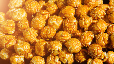 sweet Caramel Cream popcorn on the black background. Close-up picture, macro detailsの写真素材