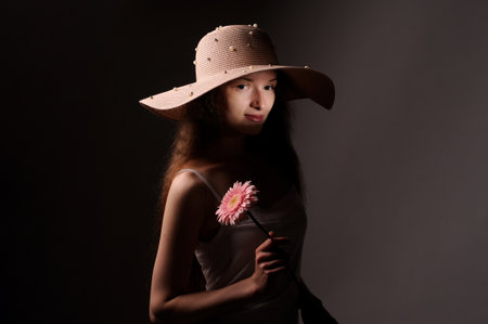 portrait of pretty woman in pink hatの写真素材