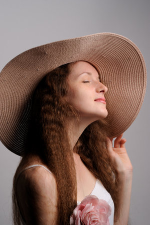 portrait of pretty woman in pink hatの写真素材