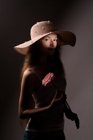 portrait of pretty woman in pink hatの写真素材