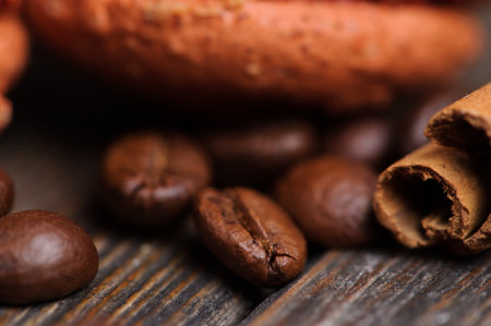 Sweet and colourful french macaroons with coffee beans on the wooden backgroundの写真素材