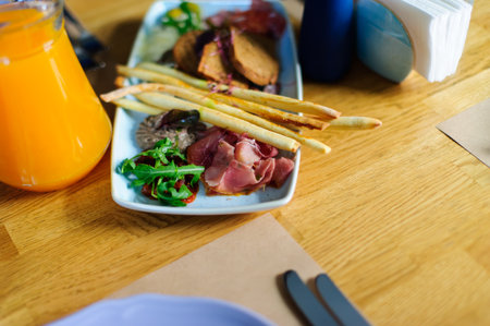 Beautiful served food on plates in restaurantの写真素材