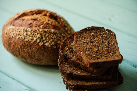 traditional bread loaf on a lime wooden boardの写真素材