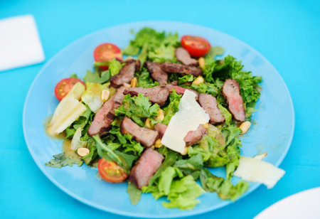 Beautiful served food on plates in restaurantの写真素材