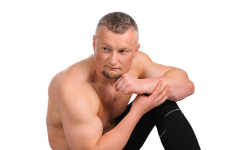 Image of muscle man posing in studio over white backgroundの写真素材
