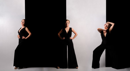 Young beautiful dancer posing in studio over black and white backgroundの写真素材
