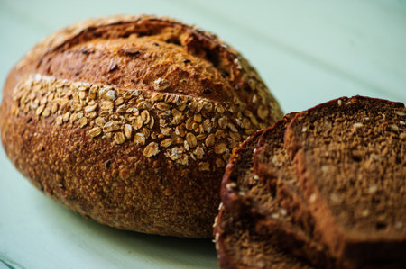traditional bread loaf on a lime wooden boardの写真素材