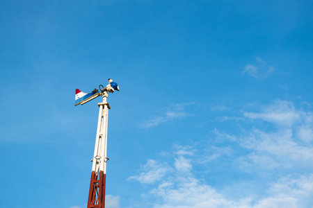The old wind turbine on blue skyの写真素材
