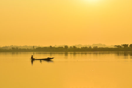 Fishermen fishing boat in the morning fog.の写真素材
