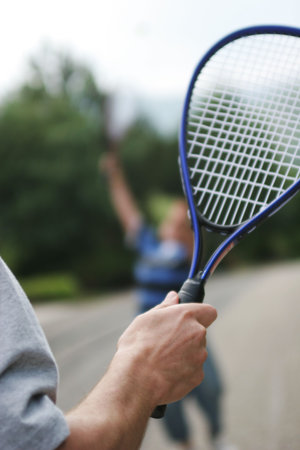 Father and son playing badminton.の写真素材