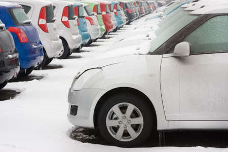 Stocked cars covered with snow in winterの写真素材