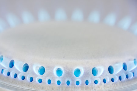 Burning blue flames of a gas stoveの写真素材