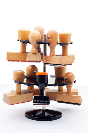 Stamp holder with many stamps - one of them with the german word for advocate, lawyer or attorney