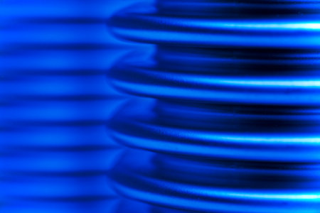 Close-up of a blue corrugated pipes or tubes of steel - selective focusの写真素材