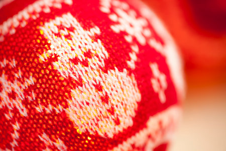 Close-up of illuminated christmas balls - woolen needlework - selective focusの写真素材