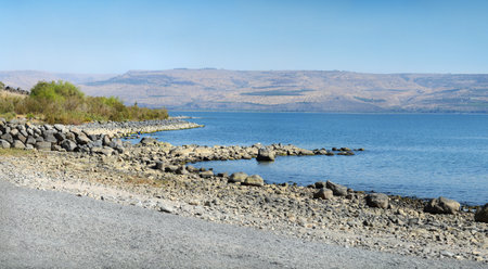 Large freshwater lake of Gennesaret in north Palestine on Gergesa land at autumn day. National golan...
