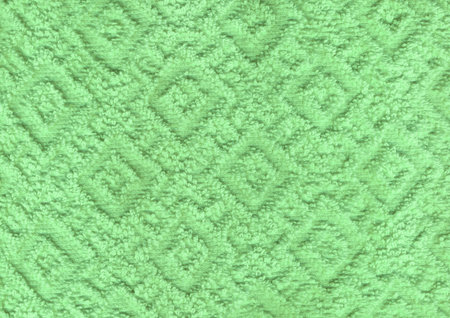 Dry new luxury light pea irish mint plain color wrinkled grainy woolen body spa towel with volume square rhombus fur even fond design. Close-up macro top detail rug view with space for textの写真素材