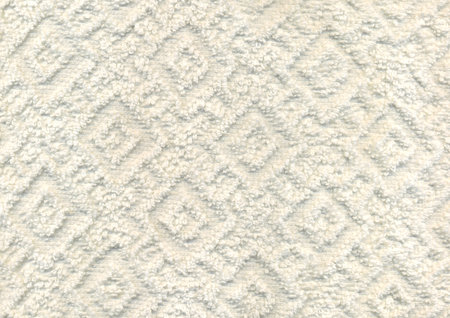 Dry new luxury light ivory creme plain color wrinkled grainy woolen body spa towel with volume square rhombus fur even fond design. Close-up macro top detail rug view with space for textの写真素材