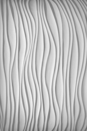 Luxury fancy template in form of sand dunes bend shape in plain air style with soft clear shadow. Beautiful pastel silver color artistic gesso emboss build fond design. View closeup with space for textの写真素材
