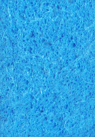 New light cyan color artificial synthetic cushion polyurethane swab wiper design for soft wet soak absorb water home use or carwash scourer. Detail spongy closeup view with space for textの写真素材