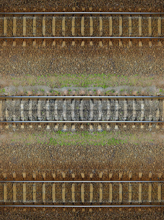 Seamless railroad Pattern, backdrop with space for text. Top view. Shiny iron rails and concrete sleepers, coupled with powerful bolts on stony ground, fortified rubble overgrown with weeds green の写真素材