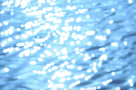Awe beautiful vibrant cyan shallow moonlight night path of round highlights spot particles on wet misty backwater area. Close-up view with space for text on fresh blur spa pool. Spring travel sceneの写真素材