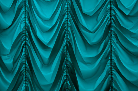 Trendy old fashioned repeating baroque soft satiny wrinkled blinds velum dark teal color with vertical plications. Romantic ancient royalty silky veil sheet design in retro style. Close up view spaceの写真素材