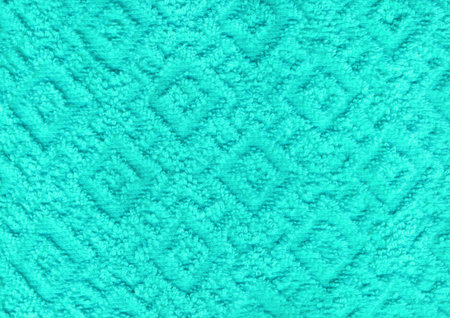 Dry new luxury light emerald teal plain color wrinkled grainy woolen body spa towel with volume square rhombus fur even fond design. Close-up macro top detail cyan rug view with space for textの写真素材