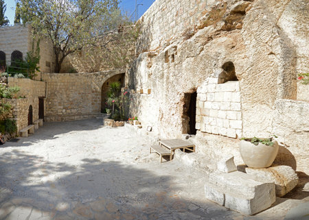 Yerushalayim, Middle East, May 2016. Scenic aged touristic sunny light view of Judea with space for text. Archaic open vacant excavated shrine entombment sepulcher. Famous sacred historic sceneの写真素材