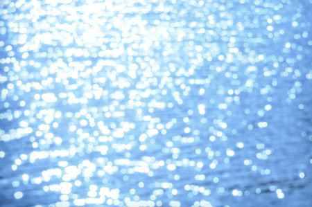 Awe beautiful vibrant cyan shallow moonlight night path of round highlights spot particles on wet misty backwater area. Close-up view with space for text on fresh blur spa pool. Spring travel sceneの写真素材